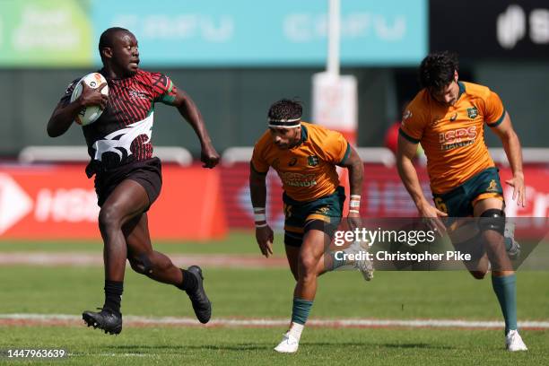 Billy Odhiambo of Kenya runs the ball during the match between Australia and Kenya on day one of the HSBC World Rugby Sevens Series - Dubai at The...