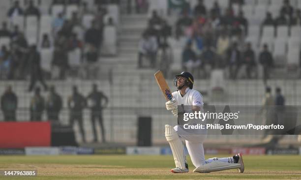 Ollie Robinson of England hits the ball in the air and is caught during the first day of the second Test between Pakistan and England at Multan...