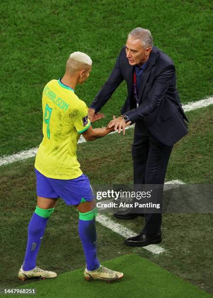 Richarlison of Brazil shakes hands with head coach Adenor Leonardo Bacchi after being substituted off during the FIFA World Cup Qatar 2022 quarter...