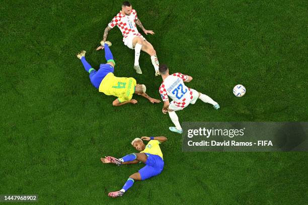 Richarlison and Rodrygo of Brazil battle for possession with Marcelo Brozovic and Josip Juranovic of Croatia during the FIFA World Cup Qatar 2022...