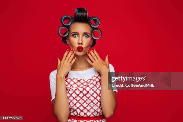 beautiful funny emotional housewife - hair rollers stock pictures, royalty-free photos & images