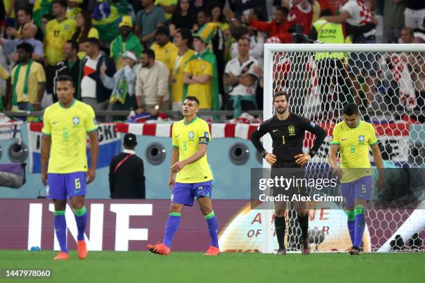 Alex Sandro, Thiago Silva, Alisson Becker and Casemiro of Brazil react after conceding a goal to Bruno Petkovic of Croatia during the FIFA World Cup...