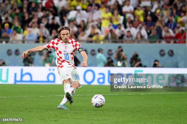 Luka Modric of Croatia scores the team's third penalty in the penalty shoot out during the FIFA World Cup Qatar 2022 quarter final match between...