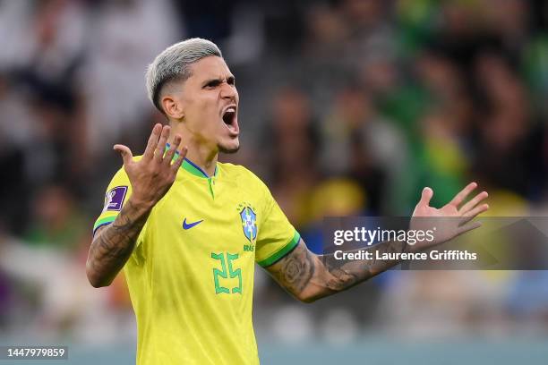 Pedro of Brazil celebrates scoring the team's third penalty in the penalty shoot out during the FIFA World Cup Qatar 2022 quarter final match between...