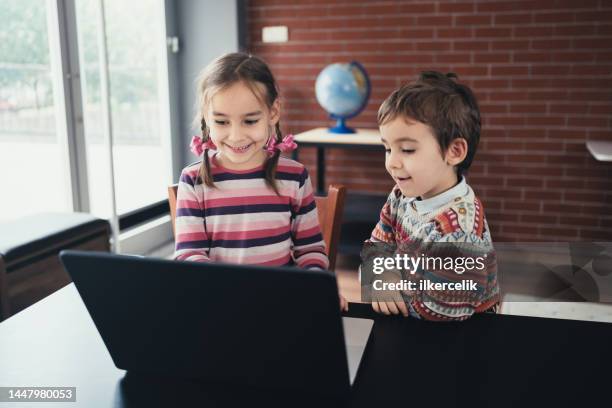 Kids Playing Video Games Laptop Photos and Premium High Res Pictures ...