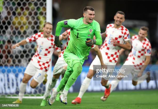 Dominik Livakovic of Croatia celebrates the win via a penalty shootout during the FIFA World Cup Qatar 2022 quarter final match between Croatia and...