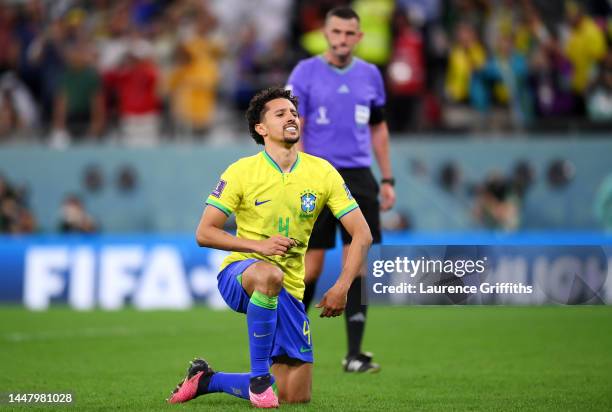 Marquinhos of Brazil reacts after missing the deciding penalty in the penalty shoot out during the FIFA World Cup Qatar 2022 quarter final match...