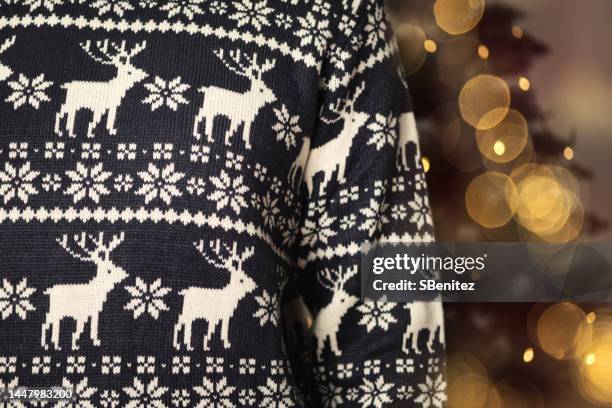 midsection of man wearing sweater - christmas sweater stock pictures, royalty-free photos & images