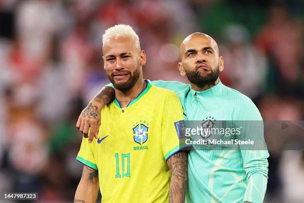 Neymar and Dani Alves of Brazil look dejected after their sides' elimination from the tournament after a penalty shoot out loss during the FIFA World...