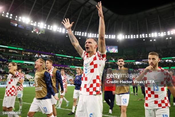 Dejan Lovren of Croatia celebrates after the team's victory in the penalty shoot out during the FIFA World Cup Qatar 2022 quarter final match between...