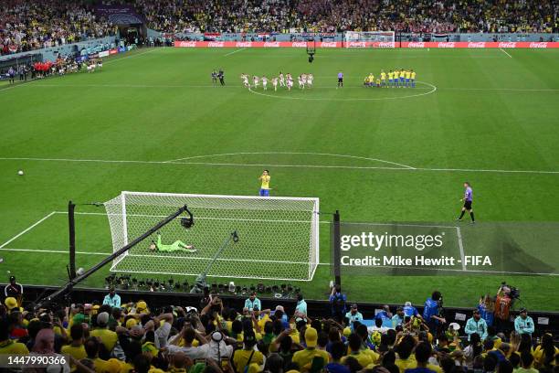 Marquinhos of Brazil reacts after missing the team's fourth penalty in the penalty shoot out during the FIFA World Cup Qatar 2022 quarter final match...