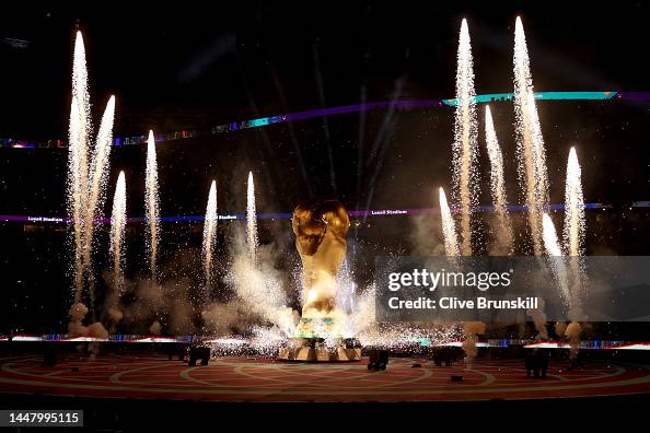 Exploding Trophy Pyrotechnics explode around a giant World Cup trophy prior to the ...