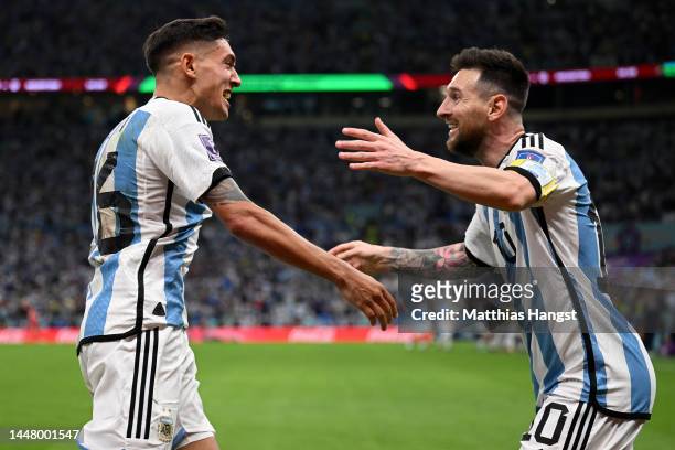 Nahuel Molina celebrates with Lionel Messi of Argentina after scoring the team's first goal during the FIFA World Cup Qatar 2022 quarter final match...