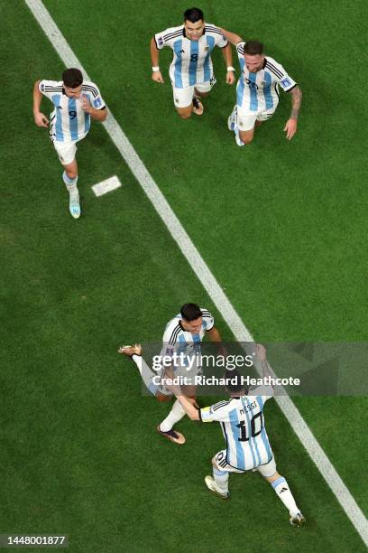 Nahuel Molina of Argentina celebrates with teammates after scoring the team's first goal during the FIFA World Cup Qatar 2022 quarter final match...