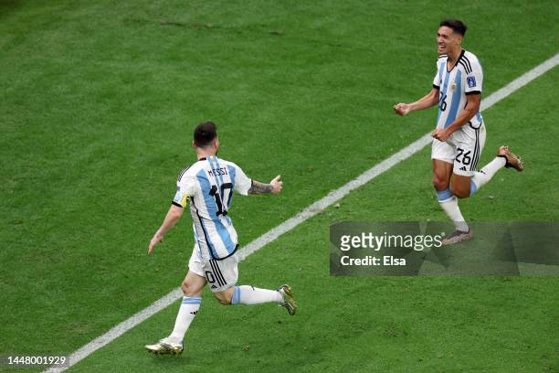 Nahuel Molina of Argentina celebrates with Lionel Messi after scoring the team's first goal during the FIFA World Cup Qatar 2022 quarter final match...