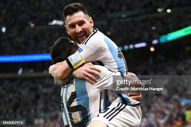 Nahuel Molina celebrates with Lionel Messi of Argentina after scoring the team's first goal during the FIFA World Cup Qatar 2022 quarter final match...