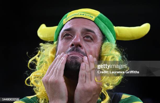 Brazil fan shows their disappointment after a loss via a penalty shootout during the FIFA World Cup Qatar 2022 quarter final match between Croatia...