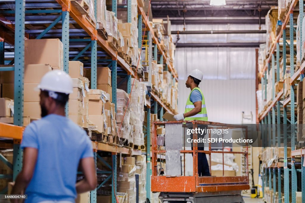 Warehouse employees working together