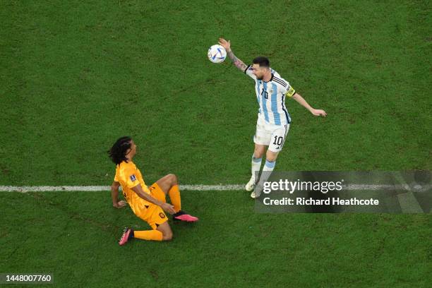 Lionel Messi of Argentina battles for possession with Nathan Ake of Netherlands during the FIFA World Cup Qatar 2022 quarter final match between...