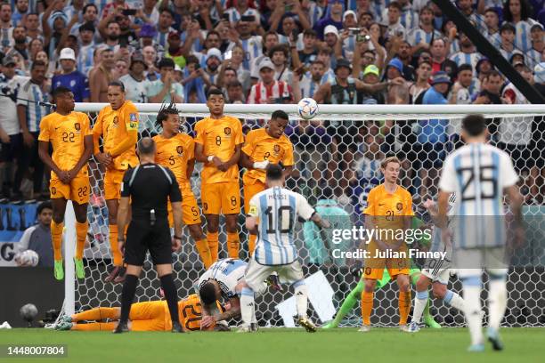 Lionel Messi of Argentina takes a free kick during the FIFA World Cup Qatar 2022 quarter final match between Netherlands and Argentina at Lusail...