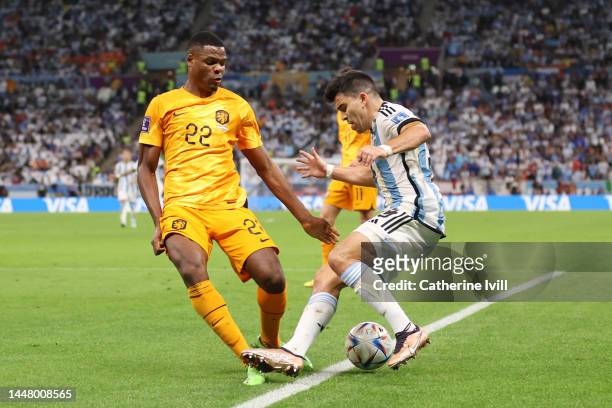 Denzel Dumfries of Netherlands fouls Marcos Acuna of Argentina in the box which leads to an Argentina penalty during the FIFA World Cup Qatar 2022...