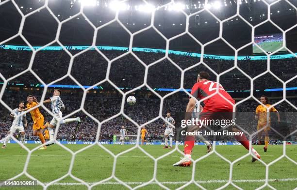 Wout Weghorst of Netherlands scores the team's first goal past Emiliano Martinez of Argentina during the FIFA World Cup Qatar 2022 quarter final...