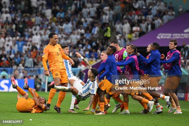 Virgil Van Dijk of Netherlands clashes with Leandro Paredes of Argentina during the FIFA World Cup Qatar 2022 quarter final match between Netherlands...