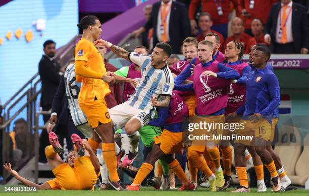 Virgil Van Dijk of Netherlands protests to Leandro Paredes of Argentina after kicking the ball toward Netherlands bench during the FIFA World Cup...