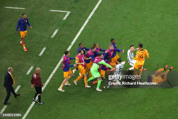 Virgil Van Dijk of Netherlands protests to Leandro Paredes of Argentina after kicking the ball toward Netherlands bench during the FIFA World Cup...