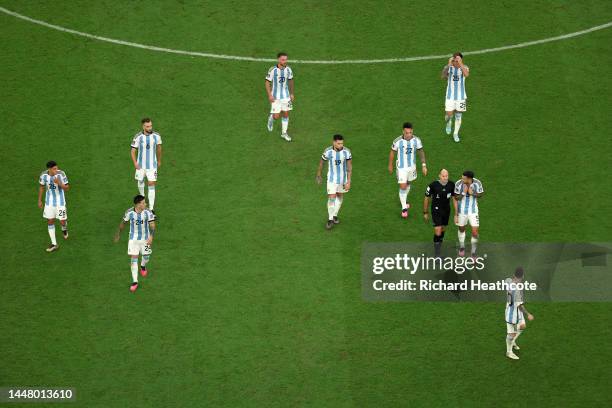 Referee Antonio Mateu is protested to by Argentina players after Netherlands scored their sides second goal during the FIFA World Cup Qatar 2022...