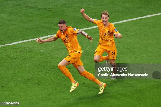 Wout Weghorst of Netherlands celebrates with teammate Frenkie de Jong after scoring the team's second goal during the FIFA World Cup Qatar 2022...