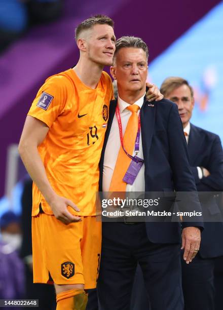 Coach Louis Van Gaal of Netherlands with Wout Weghorst of Netherlands look dejected after their sides' elimination from the tournament the FIFA World...