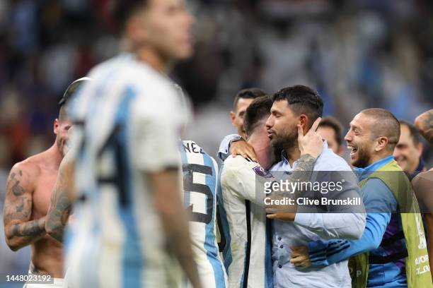 Former Argentine player Sergio Aguero congratulates Lionel Messi of Argentina after the team's victory in the penalty shoot out during the FIFA World...