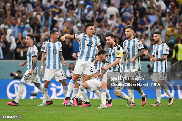 Lionel Messi of Argentina and teammates celebrate victory in the penalty shootout during the FIFA World Cup Qatar 2022 quarter final match between...