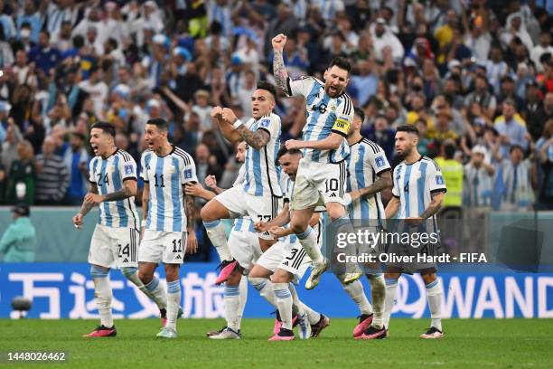 Lionel Messi of Argentina and teammates celebrate victory in the penalty shootout during the FIFA World Cup Qatar 2022 quarter final match between...