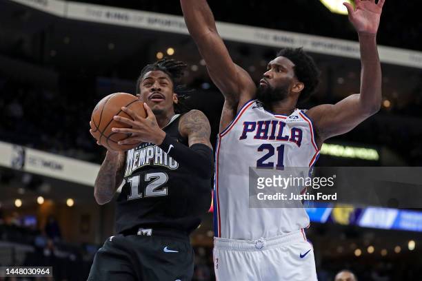 Ja Morant of the Memphis Grizzlies goes to the basket during the game against Joel Embiid of the Philadelphia 76ers at FedExForum on December 02,...