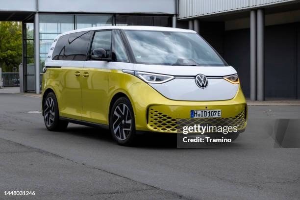 volkswagen id. buzz on a street - vw van stock pictures, royalty-free photos & images