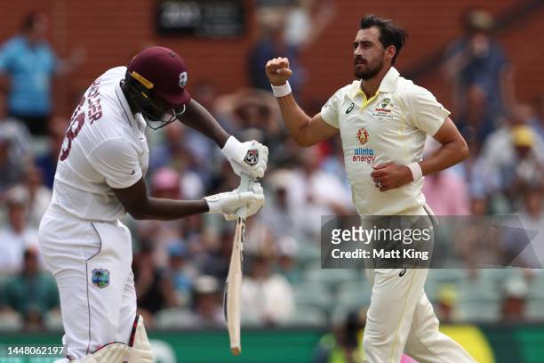 Mitchell Starc of Australia celebrates the wicket of Jason Holder of West Indies during day three of the Second Test Match in the series between...