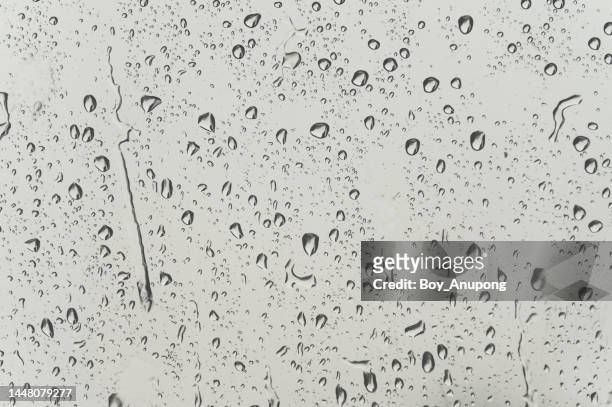 an abstract of water drop on the window glass during raining. - humid stock pictures, royalty-free photos & images