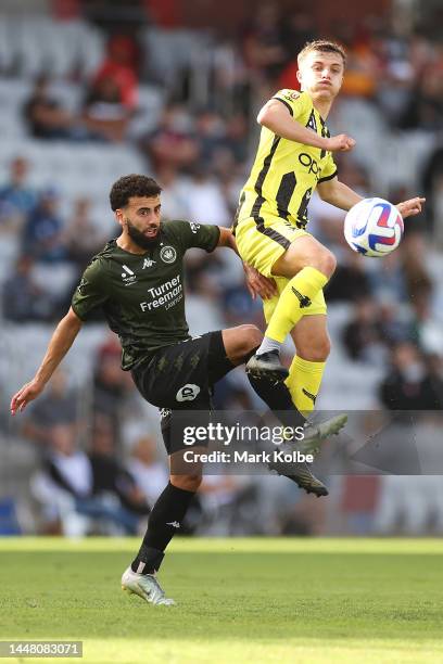 Ramy Najjarine of the Wanderers and Callan Elliot of the Phoenix compete for the ball during the round seven A-League Men's match between Wellington...