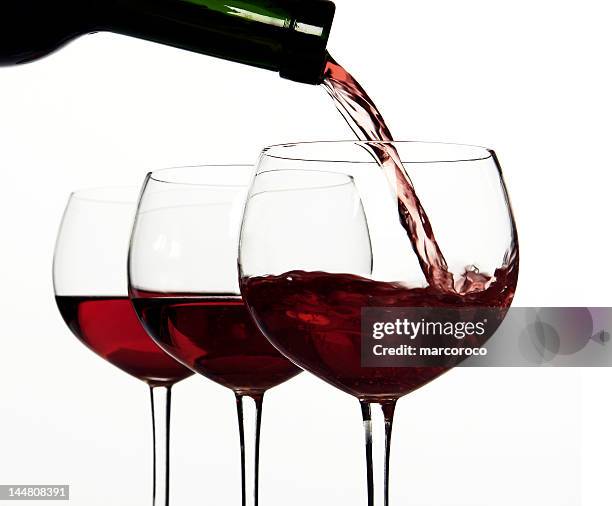 red wine, pouring - huge glass of wine stock pictures, royalty-free photos & images
