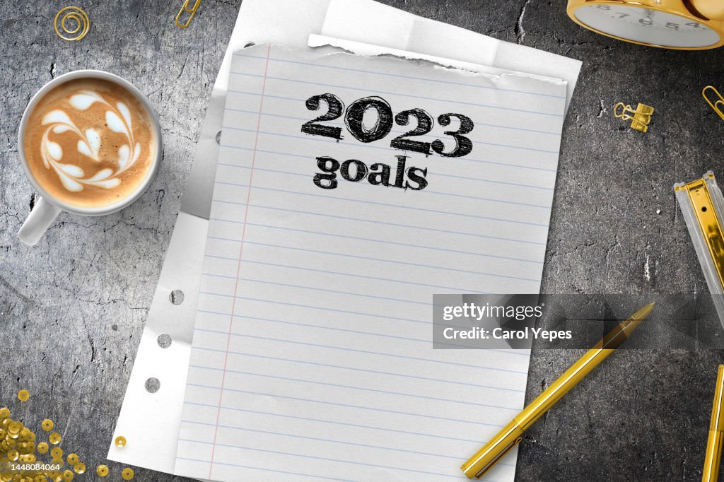 New year resolution 2023 goals in clipboard on a festive white surface