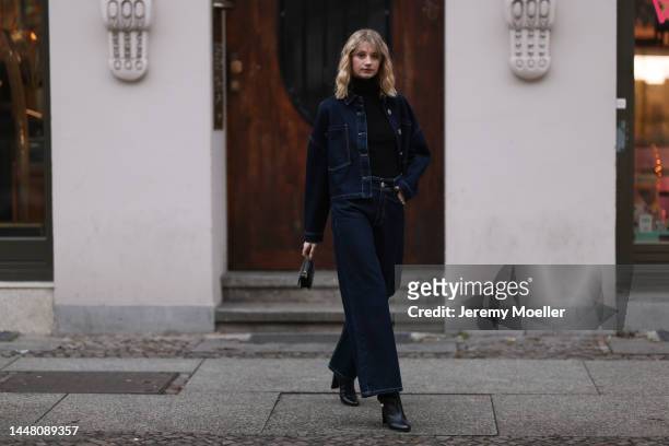 Trixi Giese seen wearing a denim look with a jeans and a jeans jacket by Blanche, a black turtleneck sweater, boots by Jimmy Choo and a Jimmy Choo...