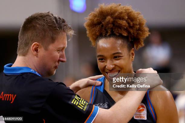 Tianna Hawkins of the Fire celebrates the win with Shannon Seebohm, Coach of the Fire during the round five WNBL match between Southside Flyers and...