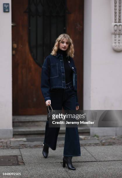 Trixi Giese seen wearing a denim look with a jeans and a jeans jacket by Blanche, a black turtleneck sweater, boots by Jimmy Choo and a Jimmy Choo...