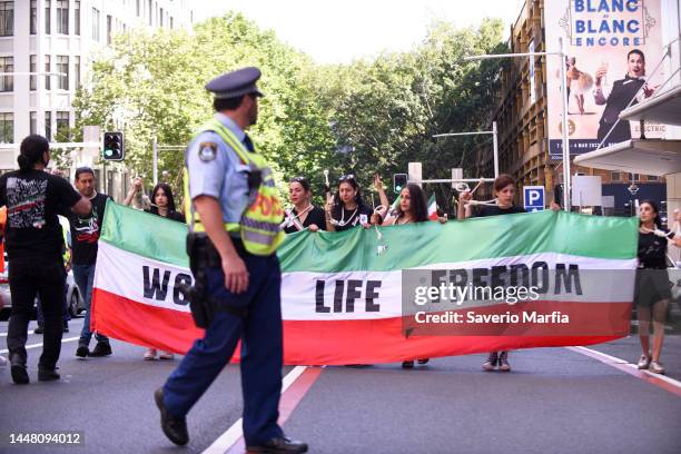 Members and supporters of the Iranian community gather during a rally on December 10, 2022 in Sydney, Australia. International Human Rights day is...