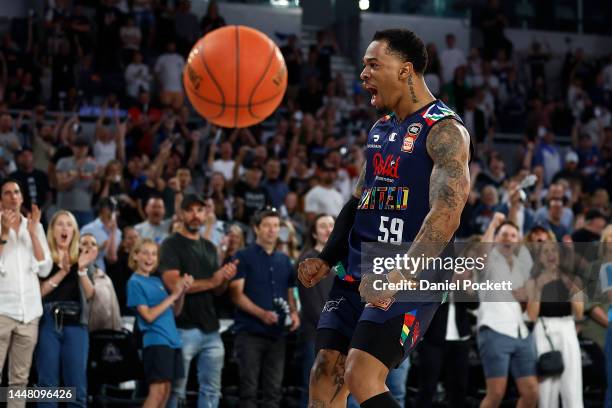 Rayjon Tucker of United celebrates a dunk during the round 10 NBL match between Melbourne United and Brisbane Bullets at John Cain Arena, on December...