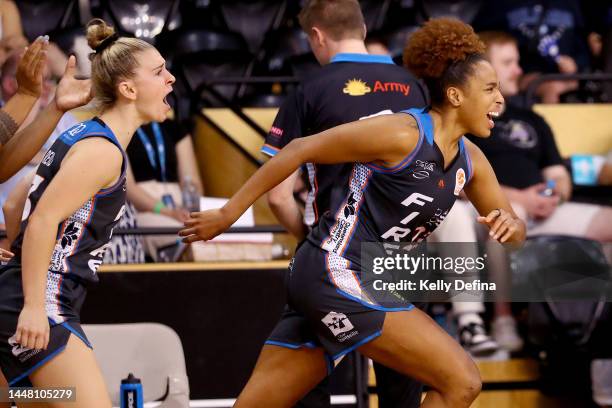 Tianna Hawkins of the Fire and Stephanie Reid of the Fire react during the round five WNBL match between Southside Flyers and Townsville Fire at...