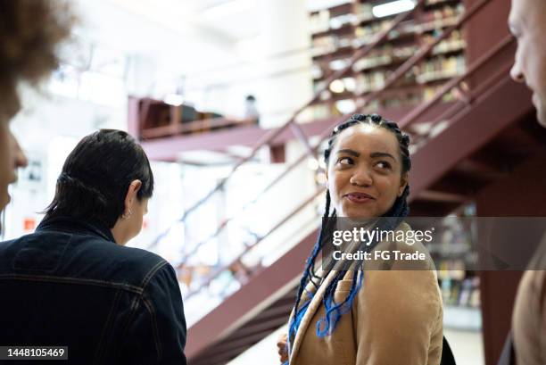Talking In The Library Student Entering Library Photos and Premium High Res Pictures - Getty ...