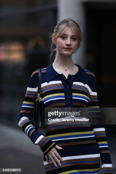 Trixi Giese seen wearing a striped long dress by Munthe, black boots by Iceberg and a black bag by Jimmy Choo on December 06, 2022 in Berlin, Germany.